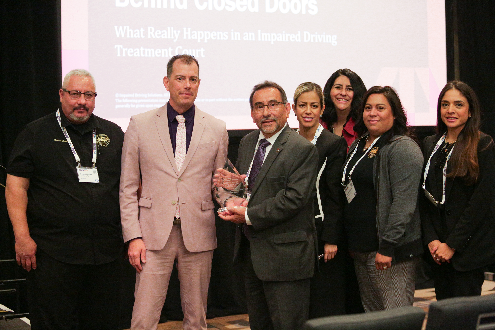 All Rise's Impaired Driving Solutions director Jim Eberspacher, second from left, presents the DWI Court Leadership Award to Judge Robert Anchondo, center, and members of his treatment court team.